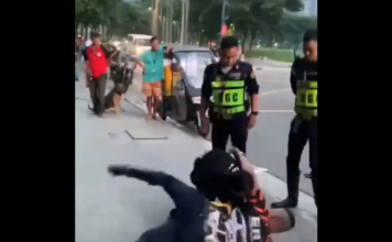 Bătaie între un polițist și un copil pe străzile din Filipine! Bătaie între un polițist și un copil pe străzile din Filipine!